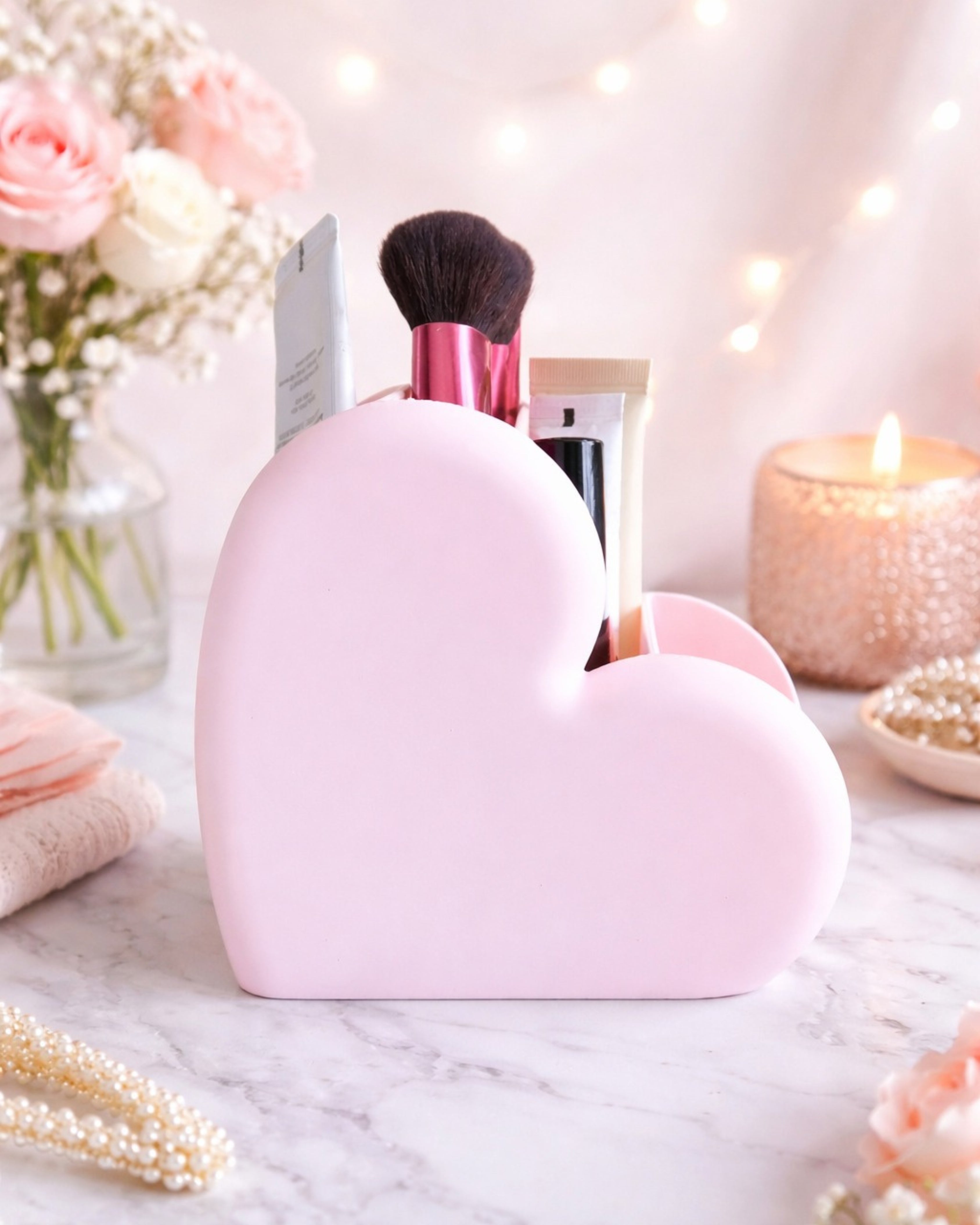 Shop now at Layered by VP.Aesthetic heart-shaped makeup organizer with multiple compartments for brushes, lipsticks, and skincare, styled on a modern vanity setup