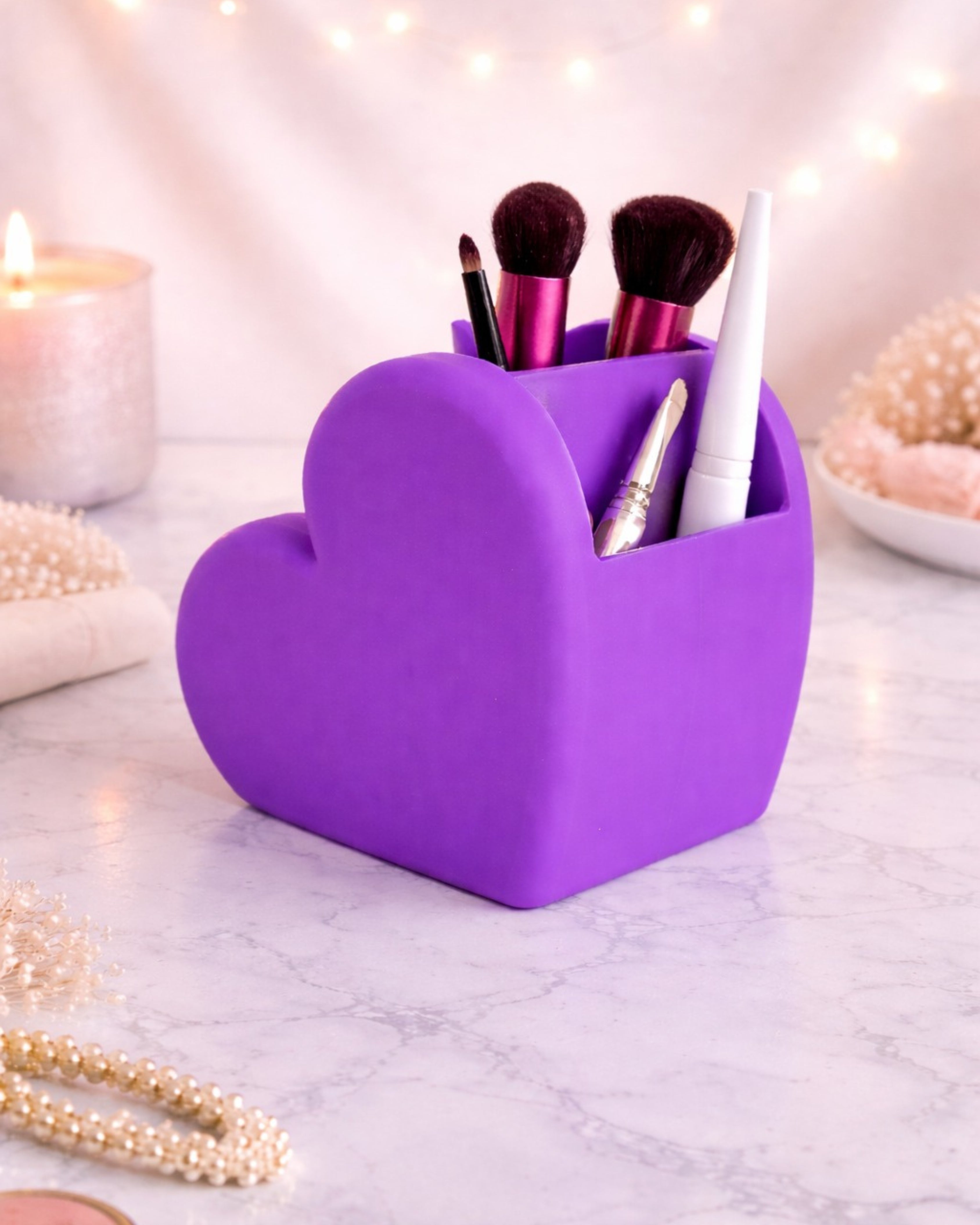 Shop now at Layered by VP.Aesthetic heart-shaped makeup organizer with multiple compartments for brushes, lipsticks, and skincare, styled on a modern vanity setup